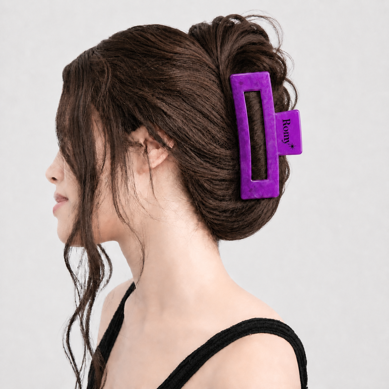 Brunette model with her hair fully secured by The Signature Romy Clip